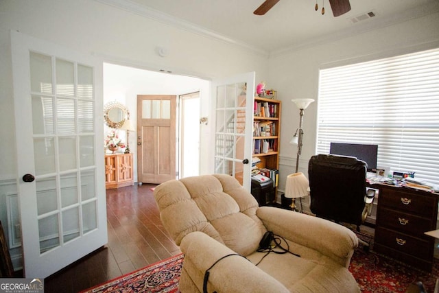 office area featuring ornamental molding, a ceiling fan, visible vents, and wood finished floors