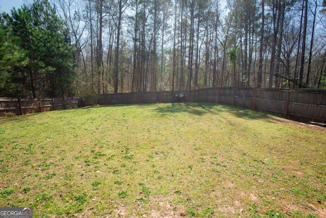 view of yard with a fenced backyard