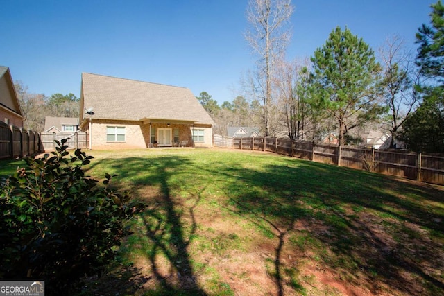 view of yard with a fenced backyard