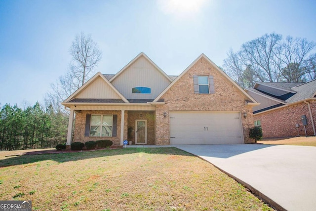 view of front of property with brick siding, a porch, concrete driveway, a front yard, and a garage