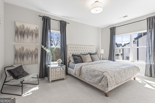 bedroom with carpet and visible vents