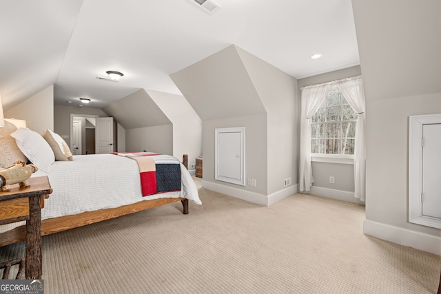 bedroom featuring lofted ceiling, light carpet, visible vents, and baseboards