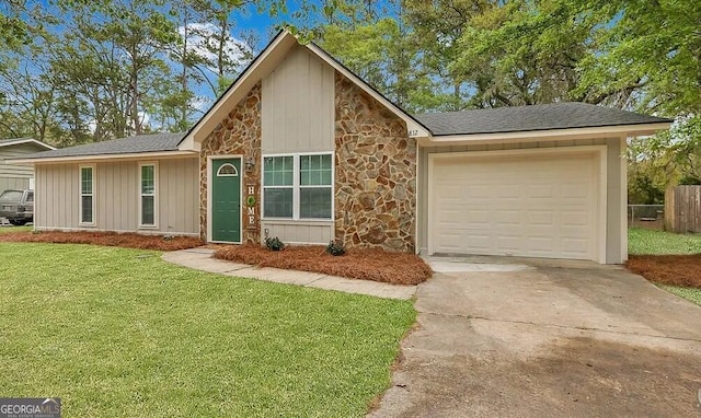 single story home with driveway, stone siding, an attached garage, and a front yard