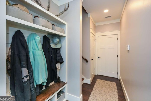 mudroom with recessed lighting, wood finished floors, visible vents, baseboards, and ornamental molding