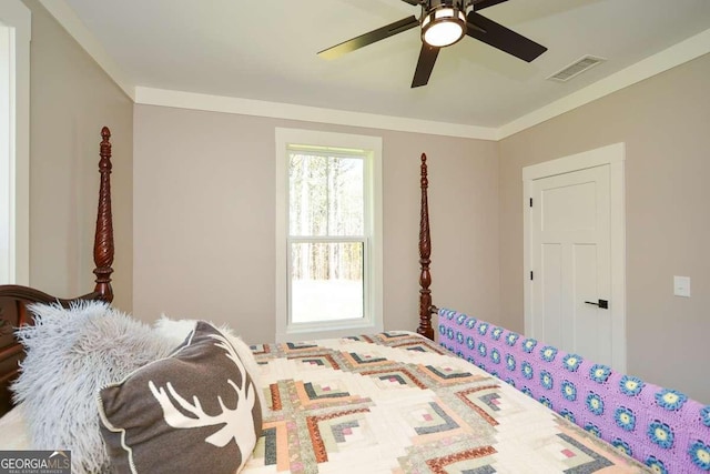 bedroom featuring ornamental molding, visible vents, and a ceiling fan