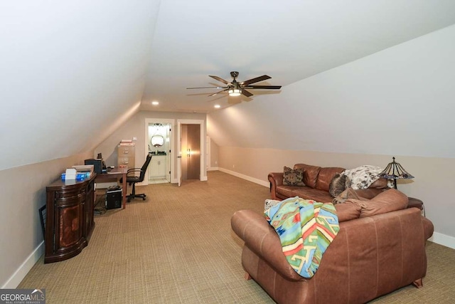 interior space featuring lofted ceiling, light colored carpet, ceiling fan, and baseboards