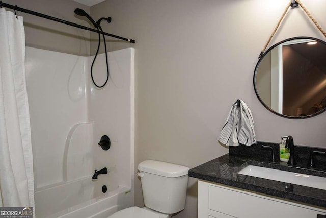 full bath with toilet, shower / bath combo with shower curtain, and vanity