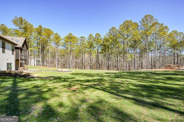 view of yard featuring a view of trees