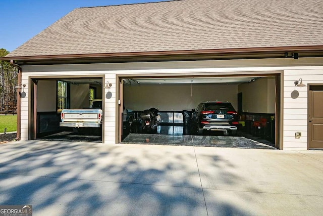 garage with concrete driveway