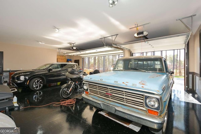 garage featuring a garage door opener