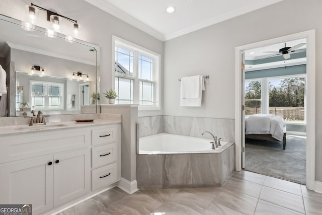 ensuite bathroom with ensuite bathroom, ornamental molding, vanity, tile patterned flooring, and a bath