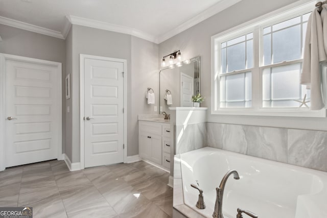 full bath with a garden tub, baseboards, ornamental molding, and vanity