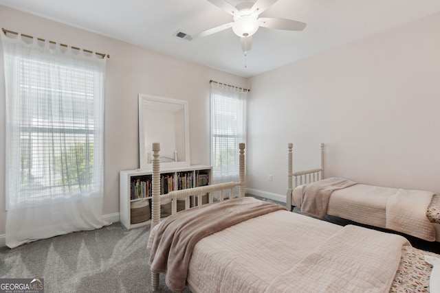 bedroom with a ceiling fan, carpet, visible vents, and baseboards