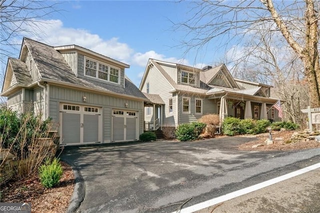 view of front of house featuring aphalt driveway and board and batten siding