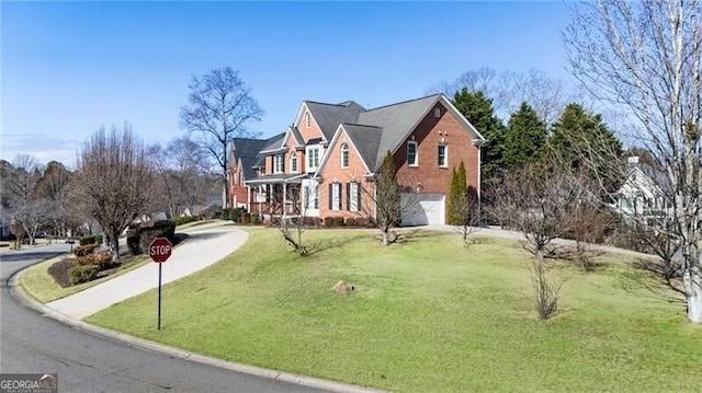 view of front of house with a garage and a front yard