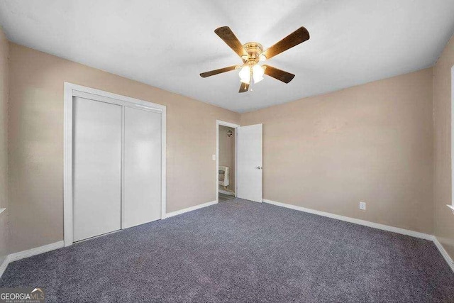 unfurnished bedroom with carpet, a closet, ceiling fan, and baseboards