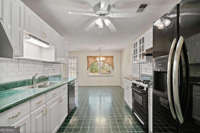 kitchen with visible vents, backsplash, white cabinets, a sink, and black appliances