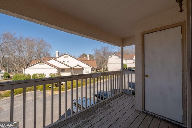 wooden deck featuring a residential view