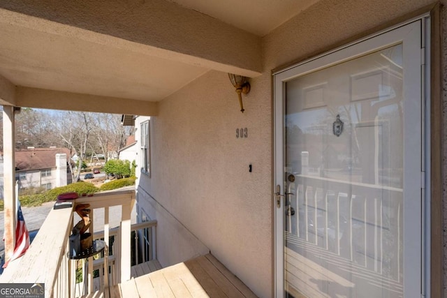 view of exterior entry featuring stucco siding