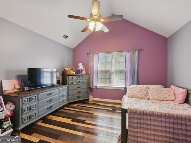 bedroom featuring ceiling fan, wood finished floors, visible vents, baseboards, and vaulted ceiling