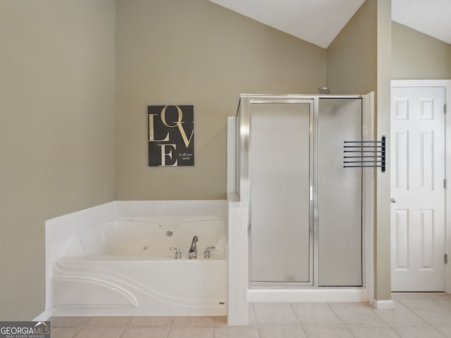 full bath featuring vaulted ceiling, a stall shower, tile patterned flooring, and a bath