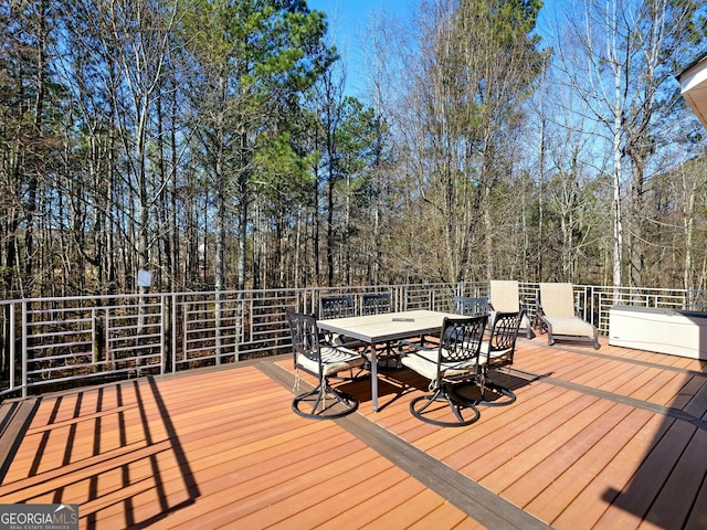 wooden deck with outdoor dining space