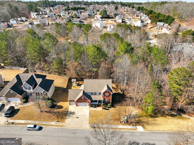 bird's eye view with a residential view and a wooded view