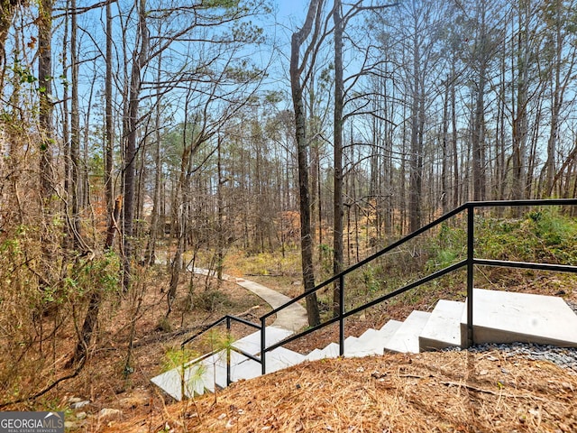 view of yard featuring a forest view