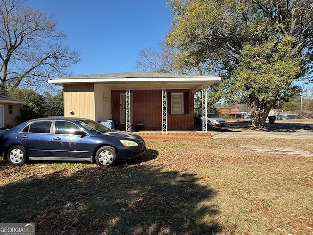 view of outdoor structure with covered porch