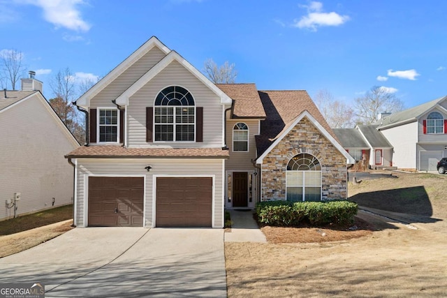 traditional home with a garage, stone siding, driveway, and a shingled roof