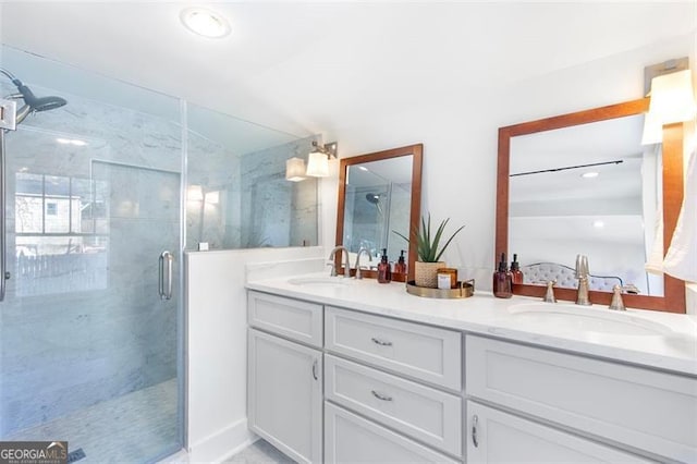 bathroom with double vanity, a shower stall, vaulted ceiling, and a sink