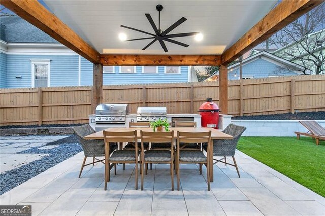 view of patio featuring ceiling fan, outdoor dining area, grilling area, and fence