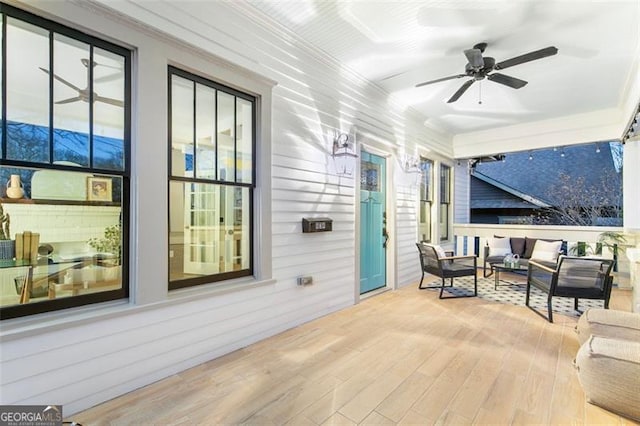 view of patio with outdoor lounge area and a ceiling fan