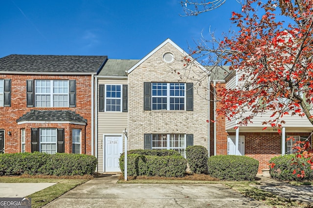 multi unit property featuring brick siding