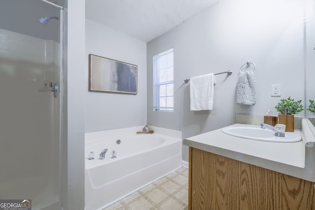 full bath featuring a textured ceiling, vanity, a bath, walk in shower, and tile patterned floors