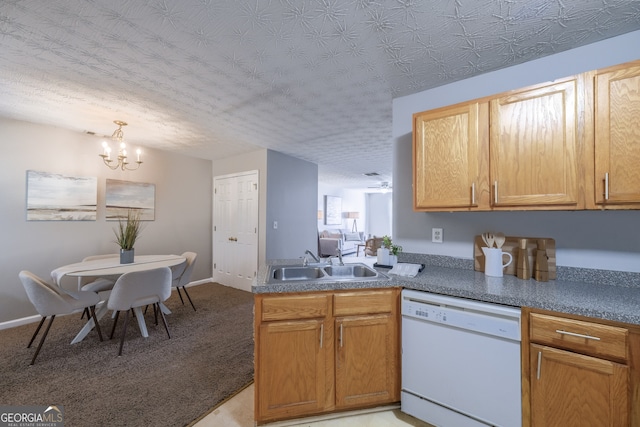 kitchen with an inviting chandelier, a sink, a textured ceiling, dishwasher, and a peninsula