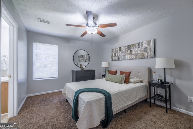 bedroom with baseboards, visible vents, a textured ceiling, and carpet flooring