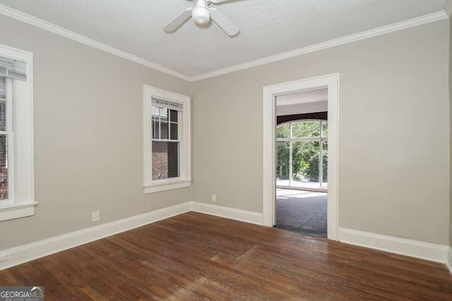 1709 Rogers Ave SW, Atlanta, GA 30310 - spare room featuring crown molding, dark wood finished floors, a ceiling fan, and baseboards