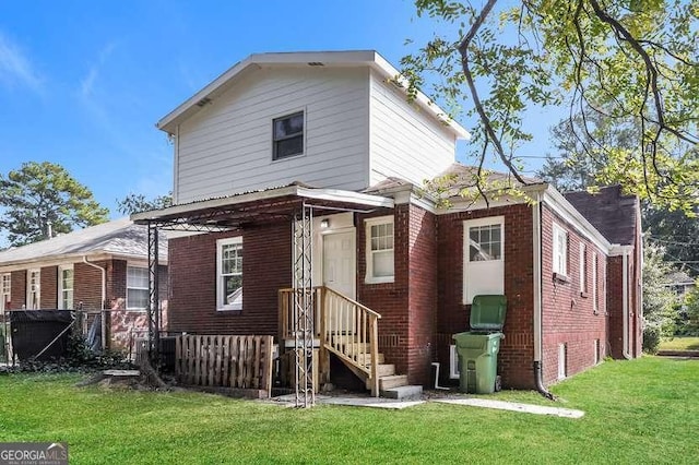 1709 Rogers Ave SW, Atlanta, GA 30310 - back of house featuring brick siding and a lawn