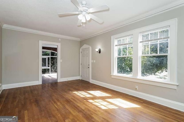 1709 Rogers Ave SW, Atlanta, GA 30310 - unfurnished living room with baseboards, ornamental molding, ceiling fan, and wood finished floors