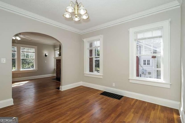 1709 Rogers Ave SW, Atlanta, GA 30310 - unfurnished dining area with baseboards, visible vents, arched walkways, and wood finished floors