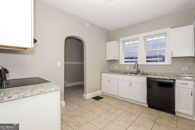 1709 Rogers Ave SW, Atlanta, GA 30310 - kitchen with arched walkways, electric stove, white cabinets, a sink, and dishwasher