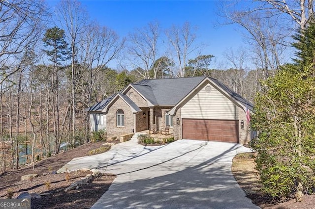 ranch-style house with an attached garage and concrete driveway