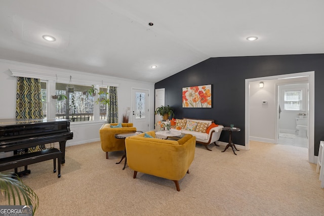 carpeted living area with recessed lighting, baseboards, and lofted ceiling