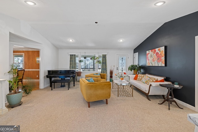 living room featuring recessed lighting, baseboards, light colored carpet, and vaulted ceiling