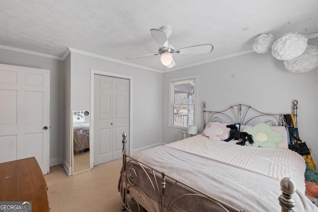 bedroom with baseboards, ornamental molding, a closet, a textured ceiling, and a ceiling fan