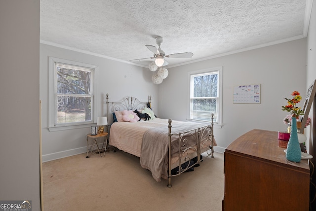 bedroom with crown molding, light colored carpet, and baseboards