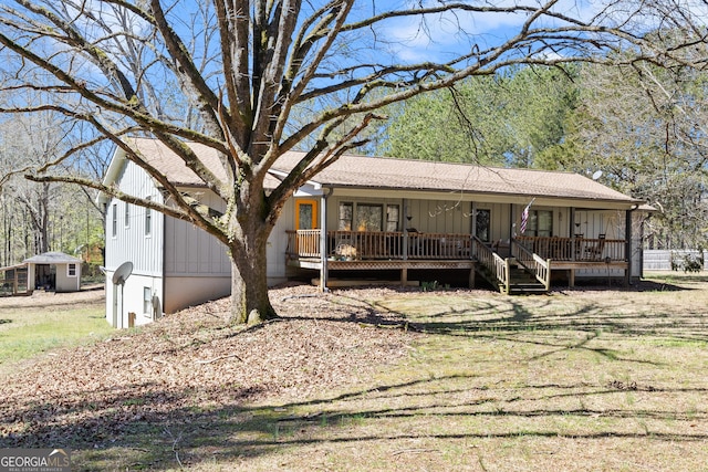 view of front of property with a porch and a shingled roof