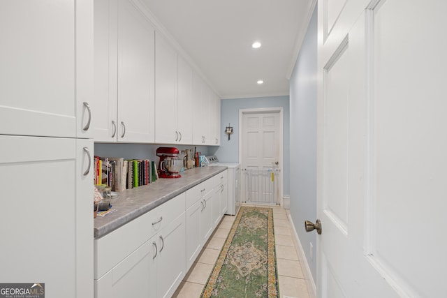 laundry room featuring ornamental molding, recessed lighting, light tile patterned floors, baseboards, and washer / dryer