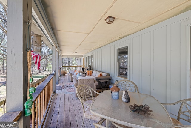 wooden deck with outdoor dining area